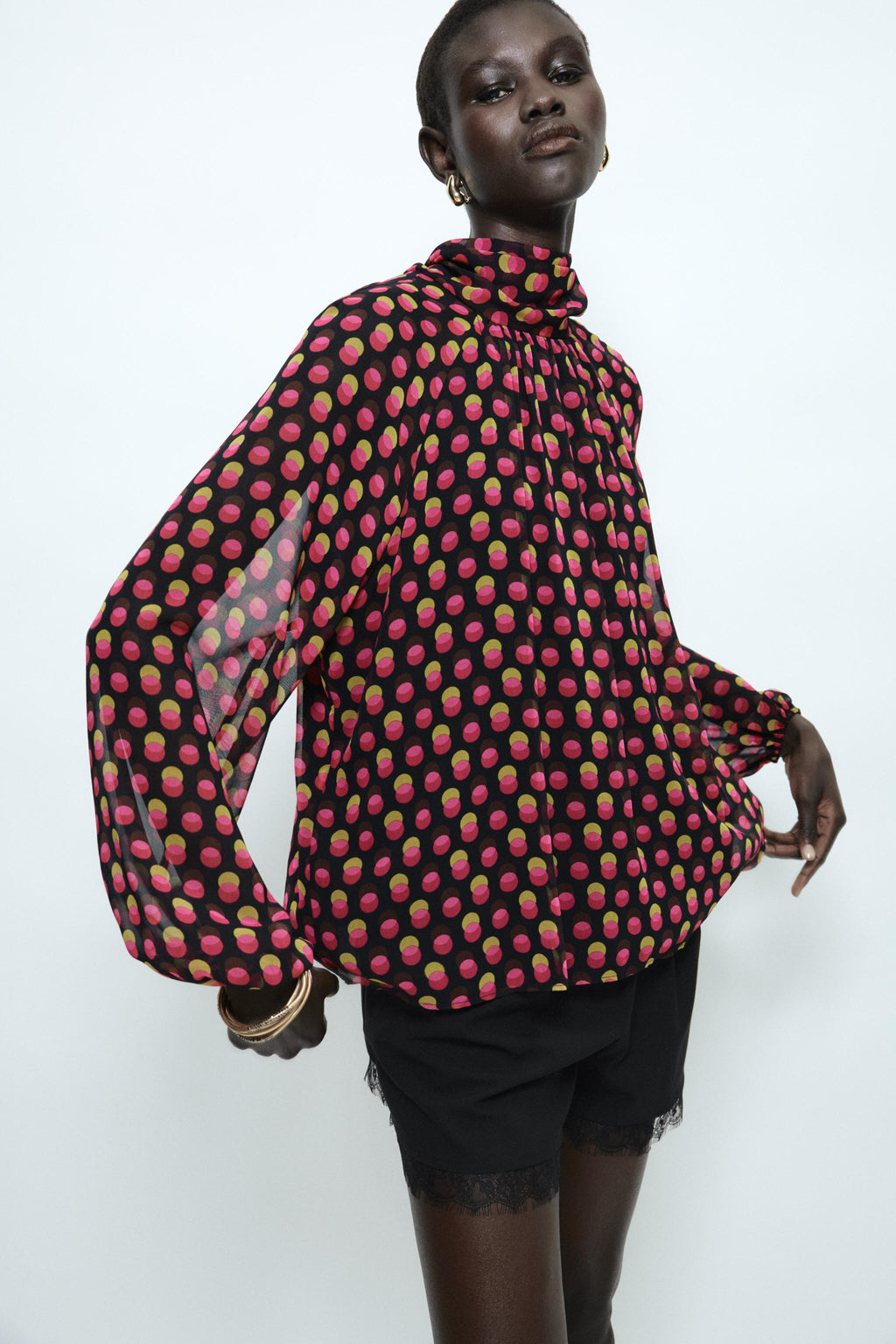 PRINTED SHIRT FEATURES A HIGH NECK POLKA DOTS