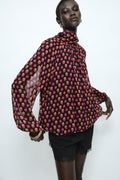 PRINTED SHIRT FEATURES A HIGH NECK POLKA DOTS