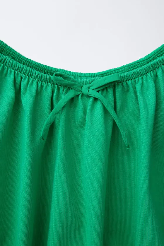 COTTON TOP FEATURING SHORT BALLOON SLEEVES