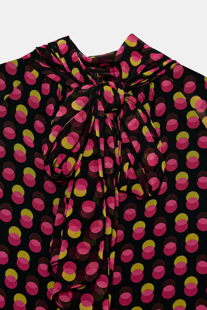 Printed shirt features a high neck polka dots